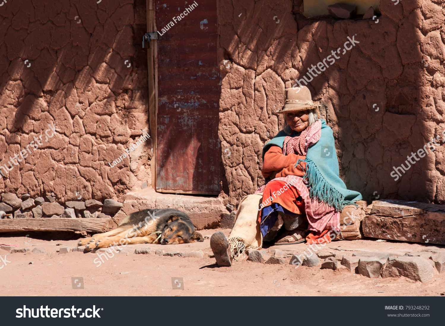 CERRILLOS - BOLIVIA, AUGUST 10, 2017: Unidentified woman in Cerrillos village on Bolivian Altiplano near Eduardo Avaroa Andean Fauna National Reserve with blue sky, Bolivia - South America #793248292