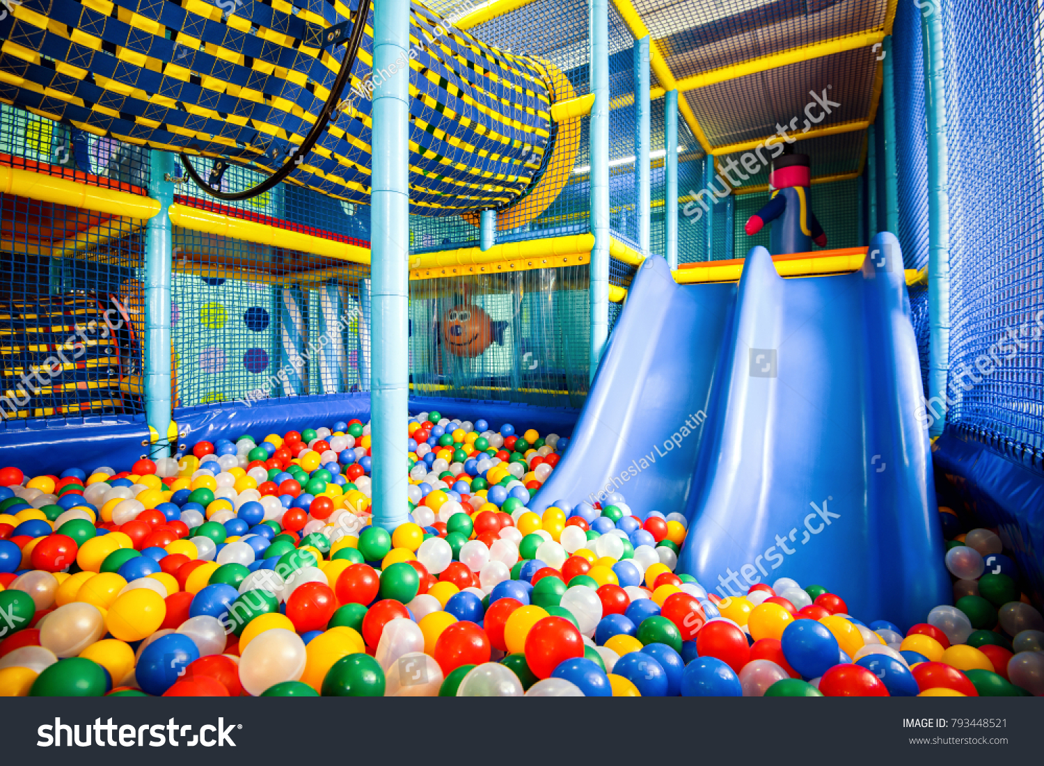 Kids playground indoor, inside big colorful plastic structure for active game, play and recreation. Dry pool, ball pit and slide. Children's playground, gym in kindergarten. Soft ground, jungle indoor #793448521