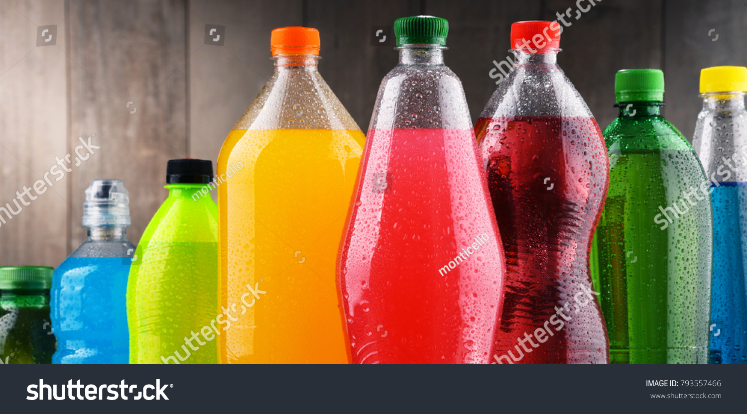 Plastic bottles of assorted carbonated soft drinks in variety of colors #793557466