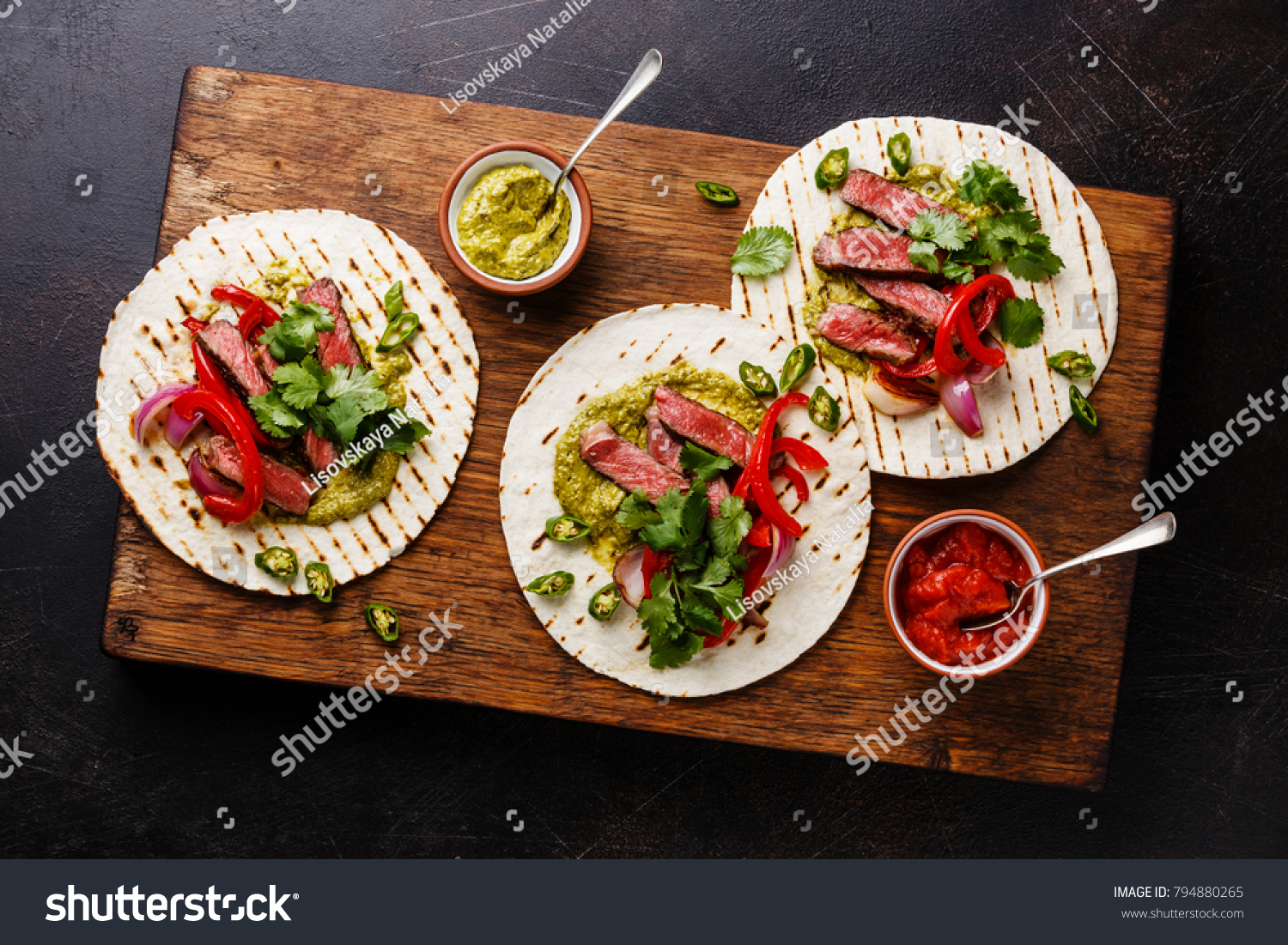 Grilled Beef steak Fajitas taco tortillas with salsa and bell pepper #794880265