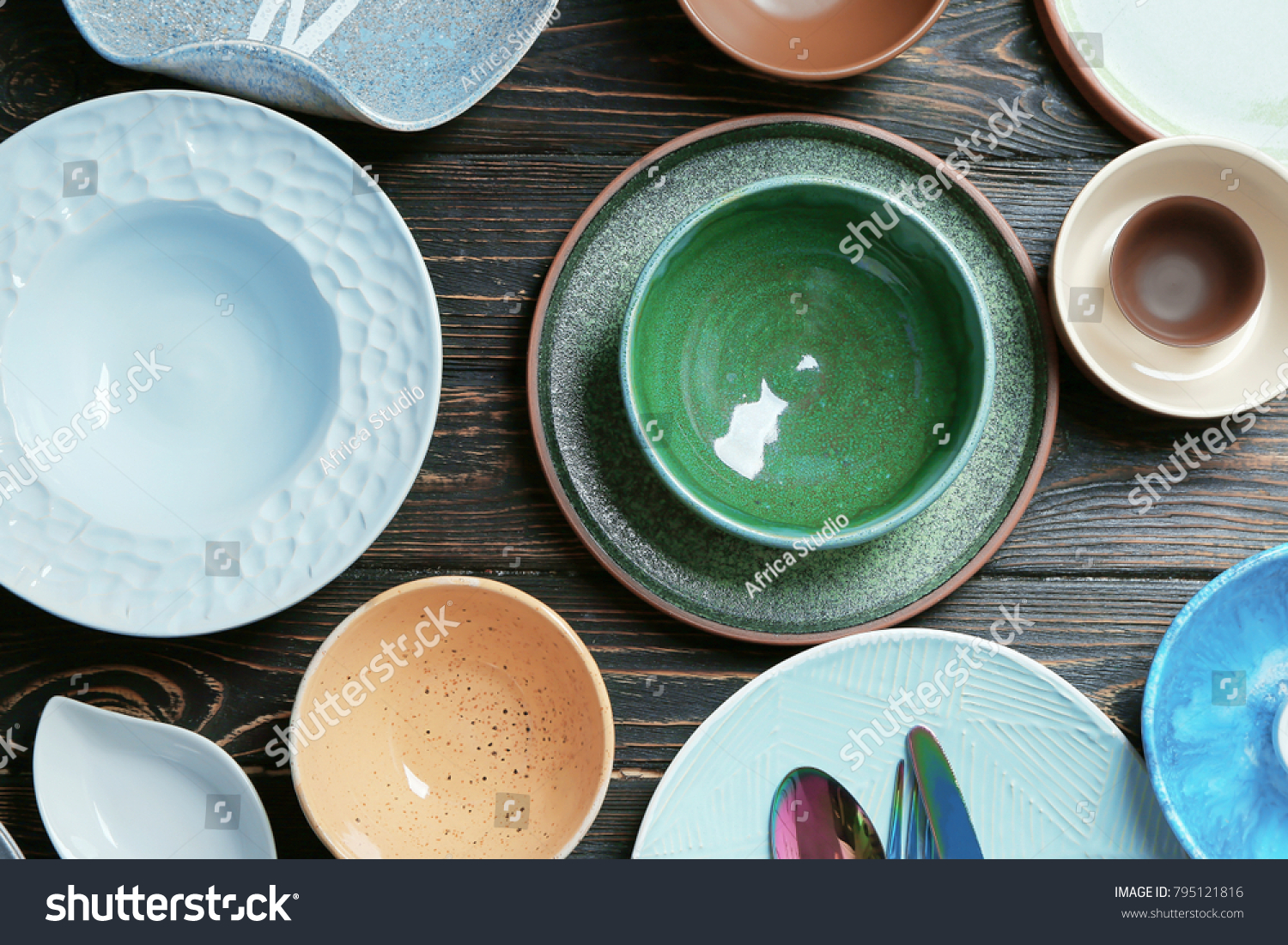 Ceramic tableware on wooden background #795121816