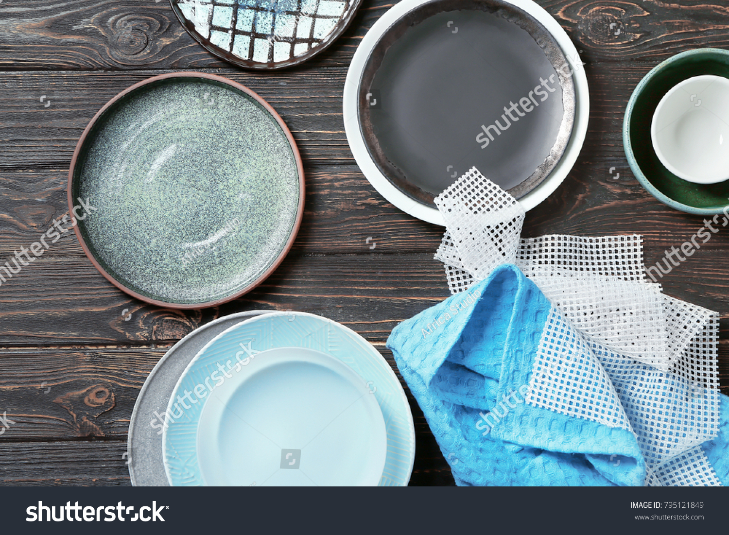 Set of tableware on wooden background #795121849