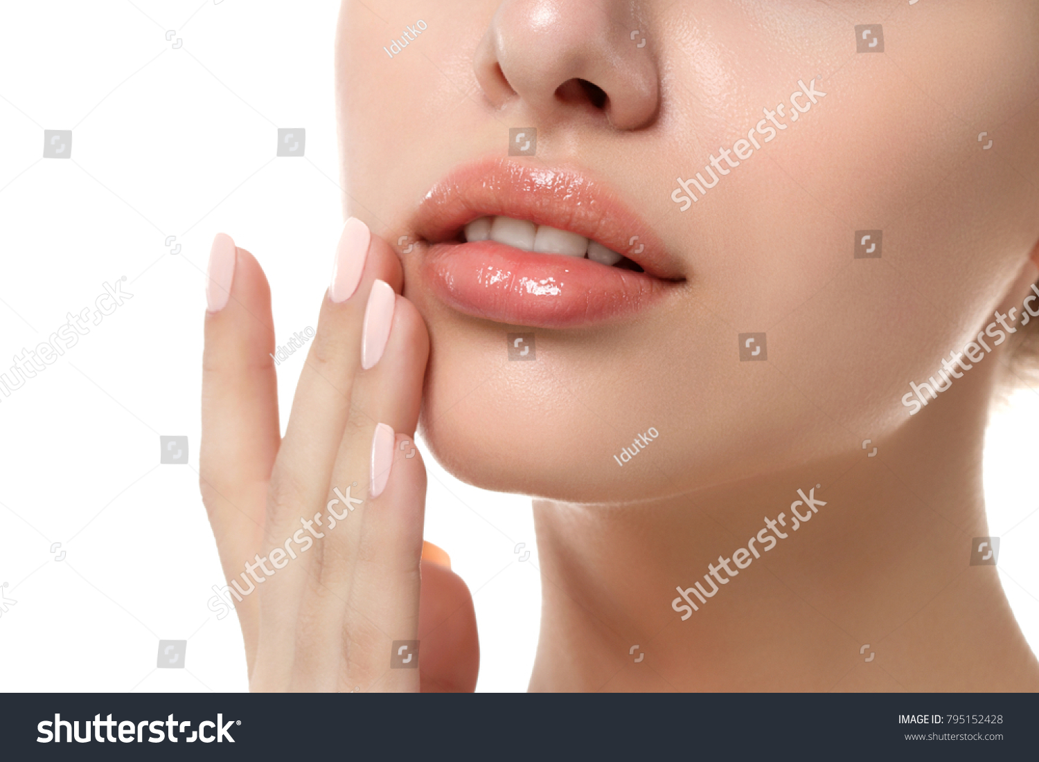 Close up view of young beautiful caucasian woman face isolated over white background. Lips contouring, SPA therapy, skincare, cosmetology and plastic surgery concept #795152428