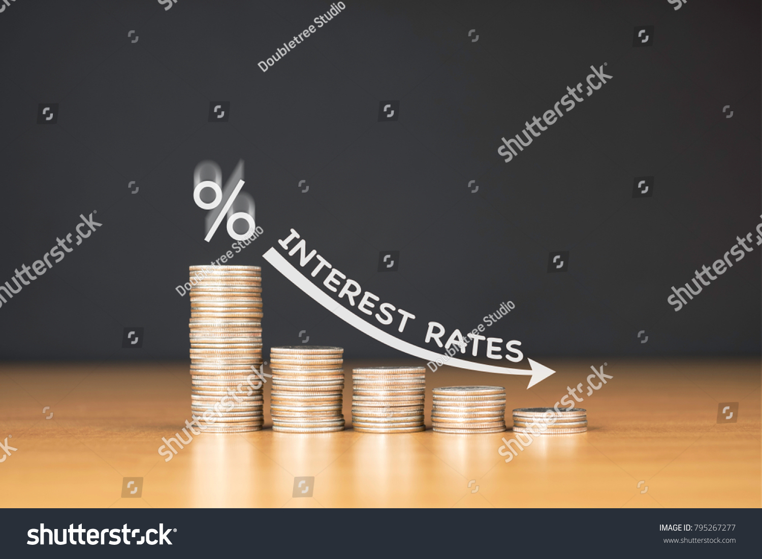 STACKED US QUARTER COINS ON WOODEN TABLE WITH WHITE ILLUSTRATION SHOWS DECREASING OF INTEREST RATES / FINANCIAL CONCEPT #795267277