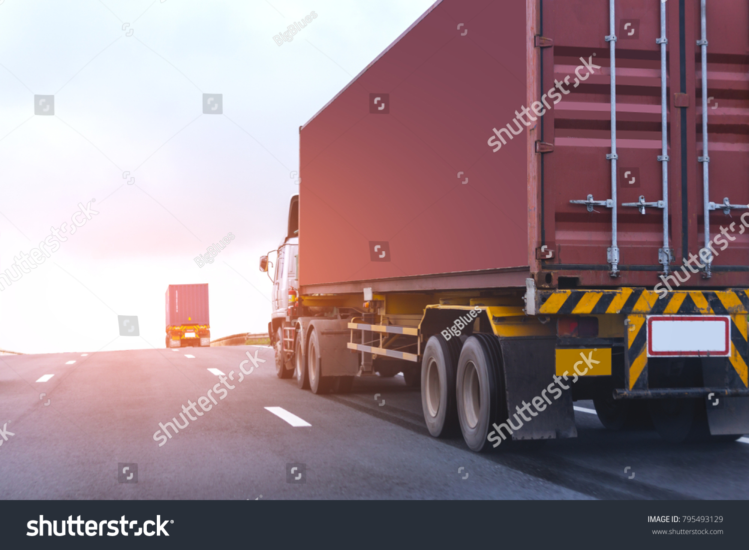 Truck on highway road with red container, transportation concept.,import,export logistic industrial Transporting Land transport on the asphalt expressway with blue sky #795493129