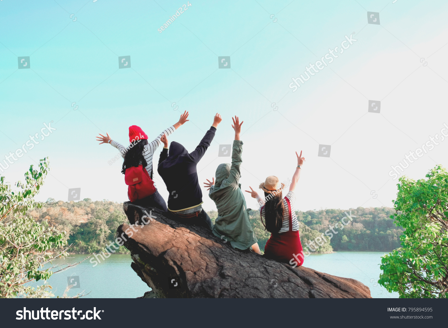 Group of Four best friends laughing and having a good time while hiking in wild forest, beauty of nature. Relax time on holiday concept travel, Thailand. #795894595