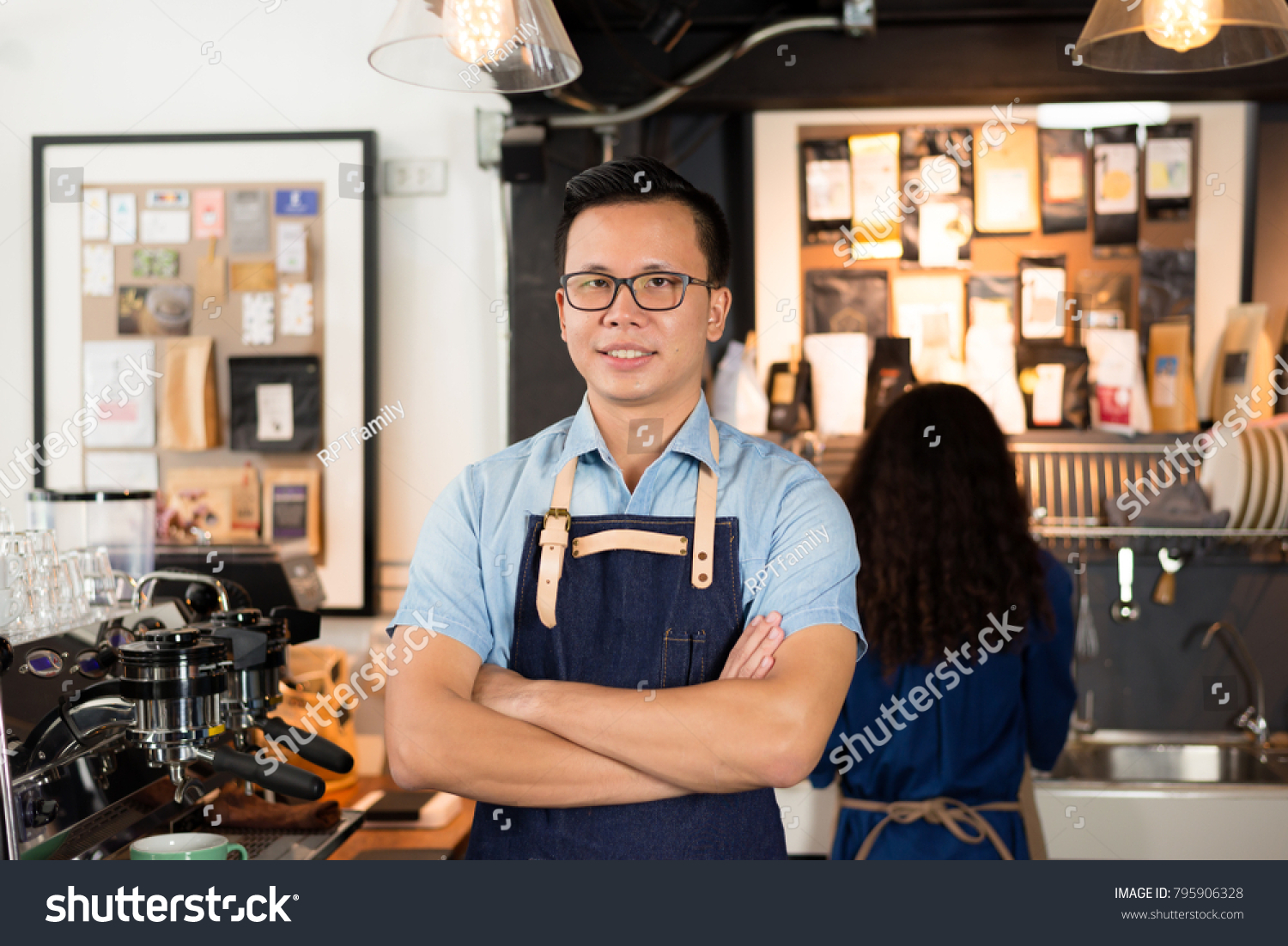 Young asian men barista smiling at coffee shop counter background, start up small business owner food and drink concept. #795906328