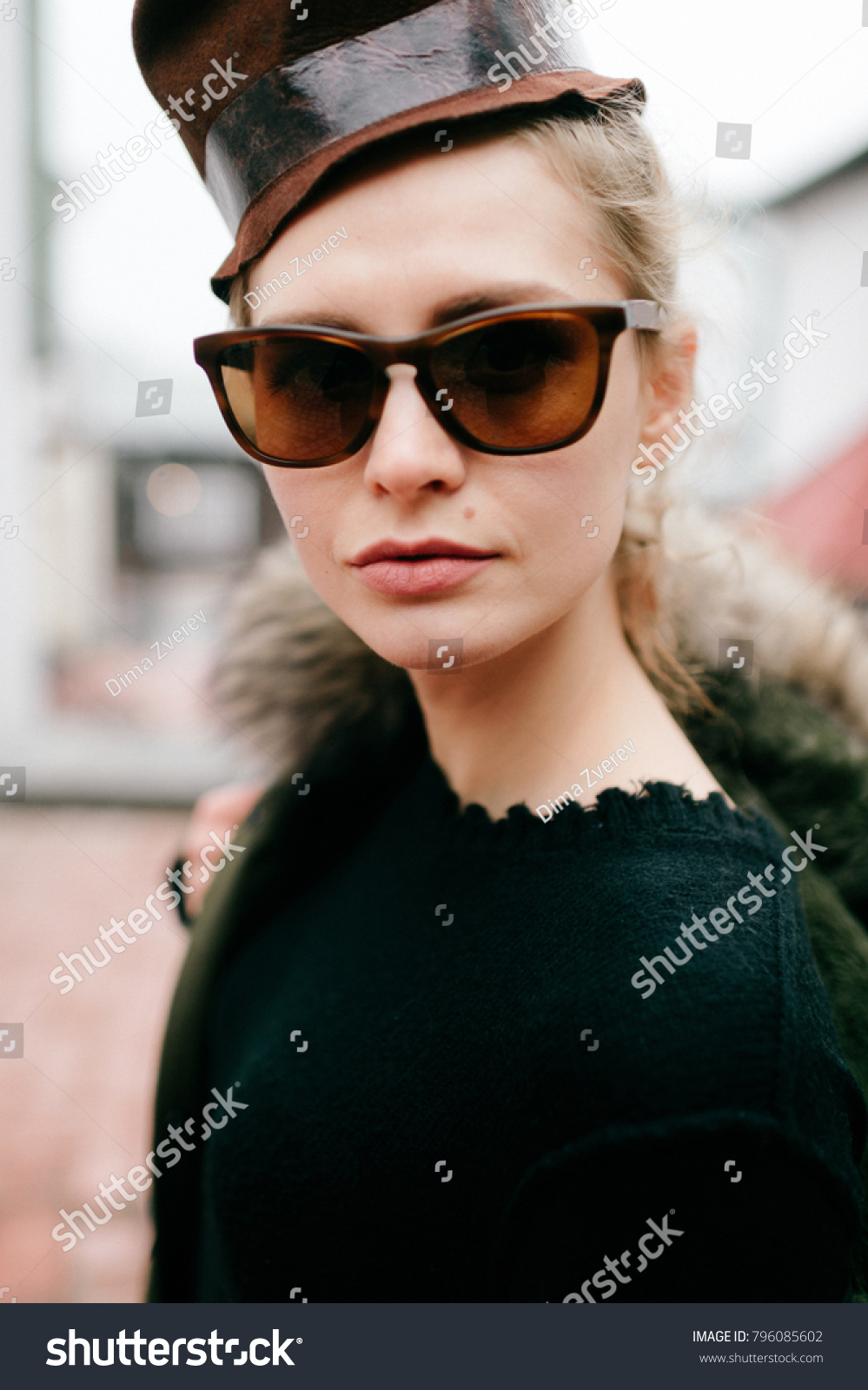 Closeup portrait of odd bizarre kinky beautiful cute young famous celebrity fashion caucasian blonde model woman in rich modern trendy sunglasses. Lovely girl posing for camera in stylish clothing #796085602