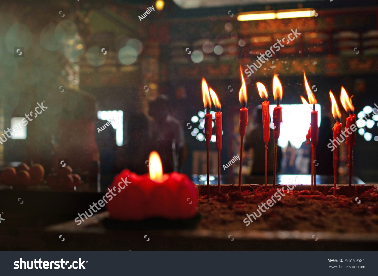 Burning red chinese candle in temple #796199584