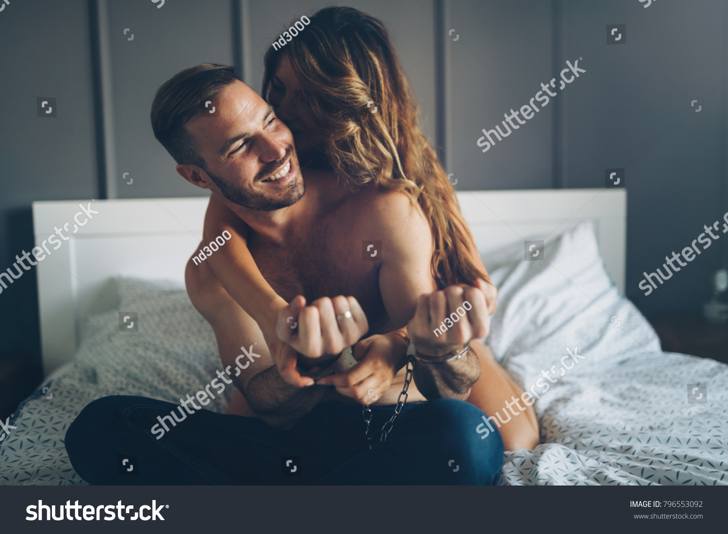 Woman and man playing domination games in bed #796553092