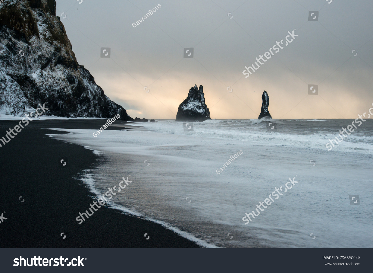 black sand beach of Reynisfjara and the mount Reynisfjall from the Dyrholaey promontory in the southern coast of Iceland, Vik #796560046