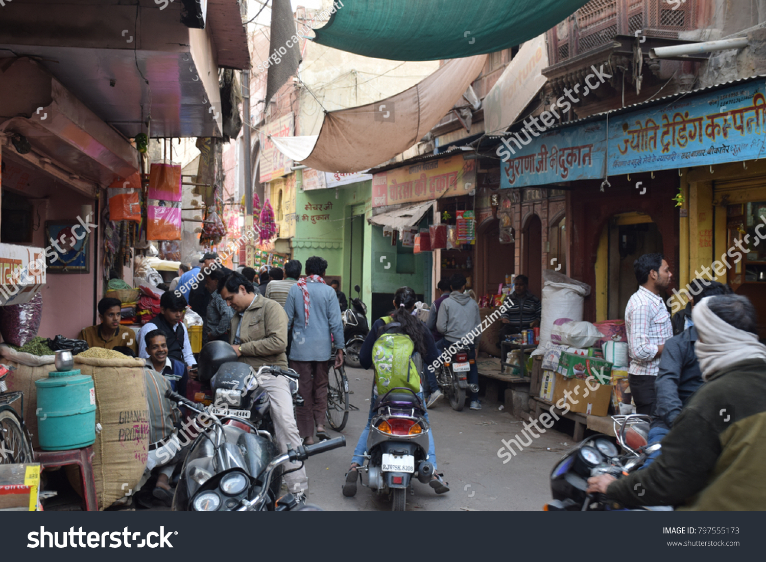 BIKANER, RAJASTHAN, INDIA - FEBRUARY 13 - View of a busy street with people and shops on february 13, 2016 in Bikaner #797555173