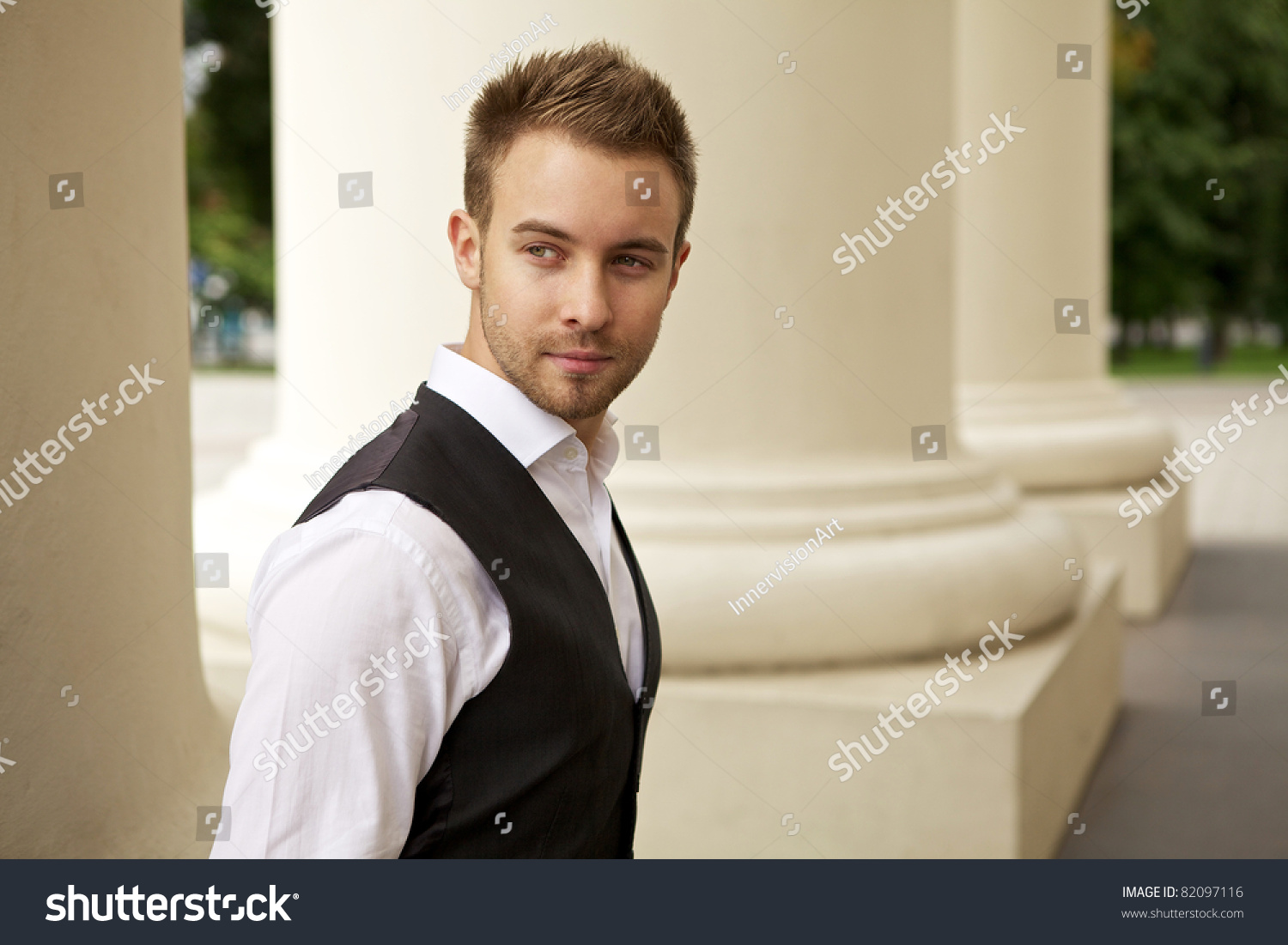 Portrait of a cheerful young businessman #82097116