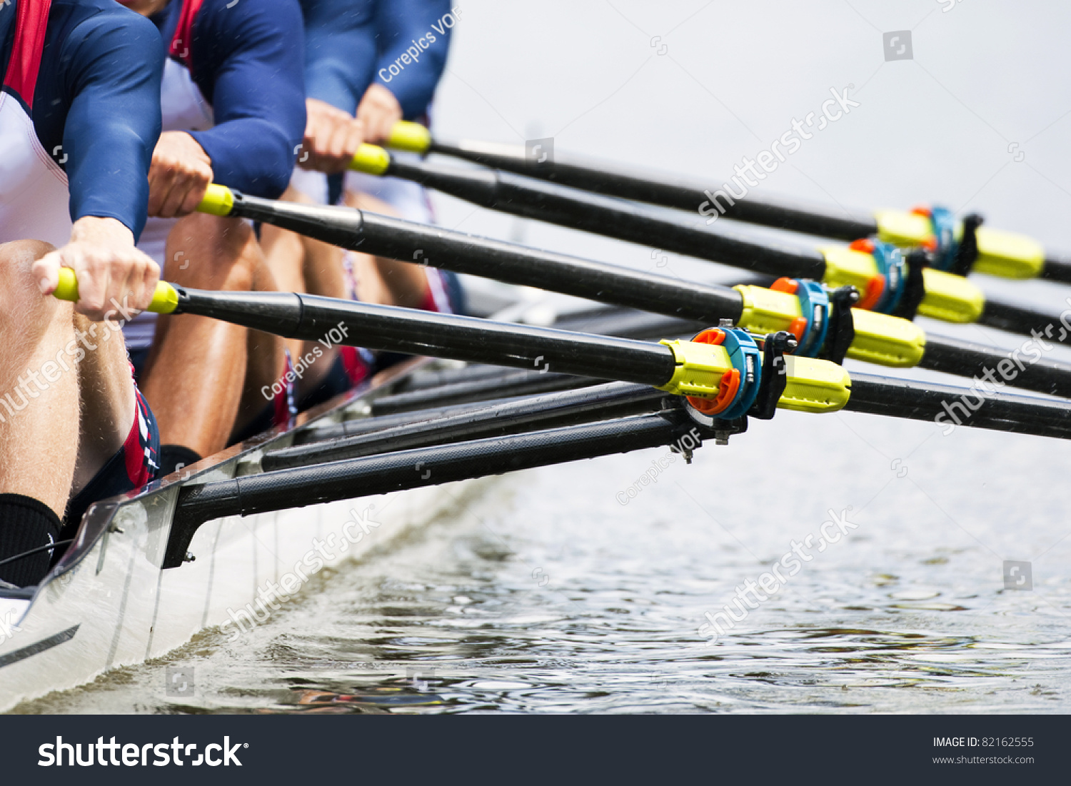 Close up of a men's quadruple skulls rowing team, seconds after the start of their race #82162555