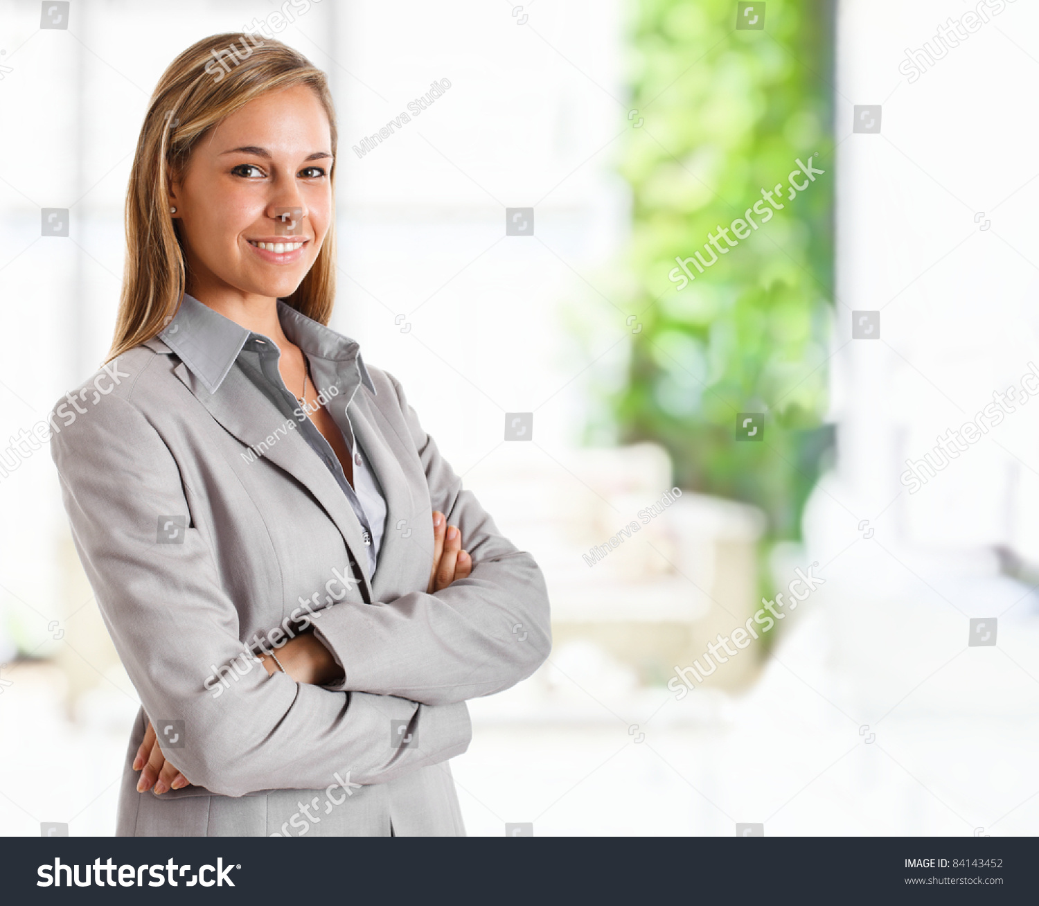 Portrait of a young smiling businesswoman #84143452