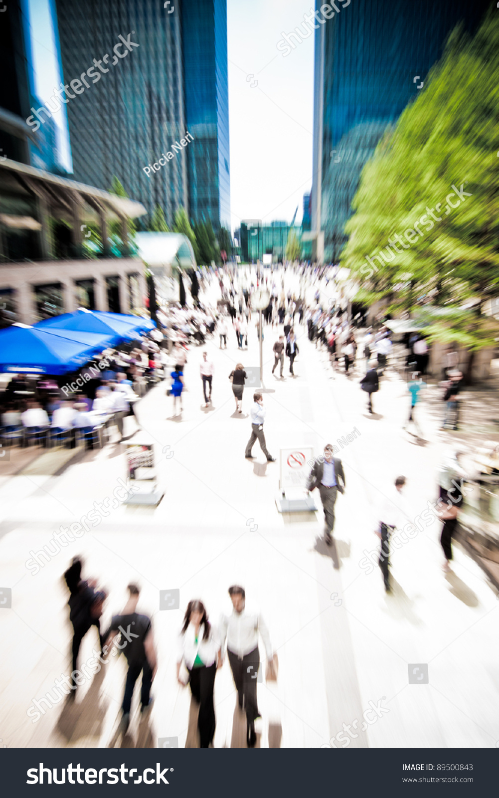 Zoom on business people rushing around at Canary Wharf, London. Motion blur. #89500843