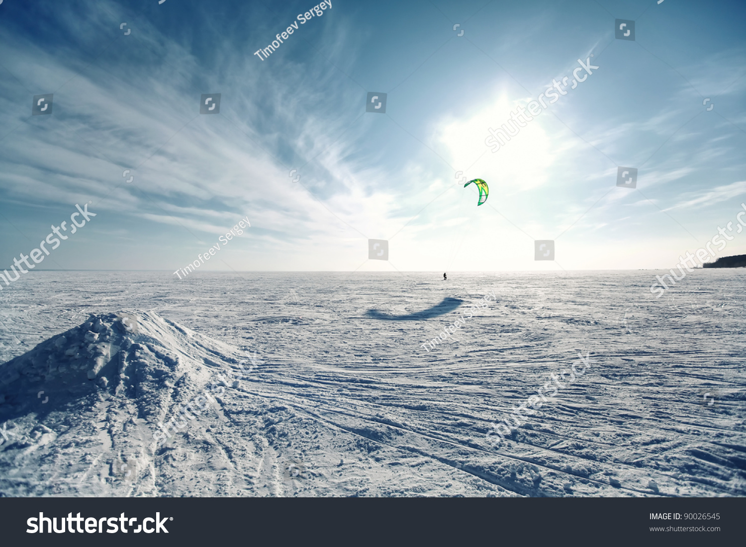 Ski kiting on a frozen lake #90026545