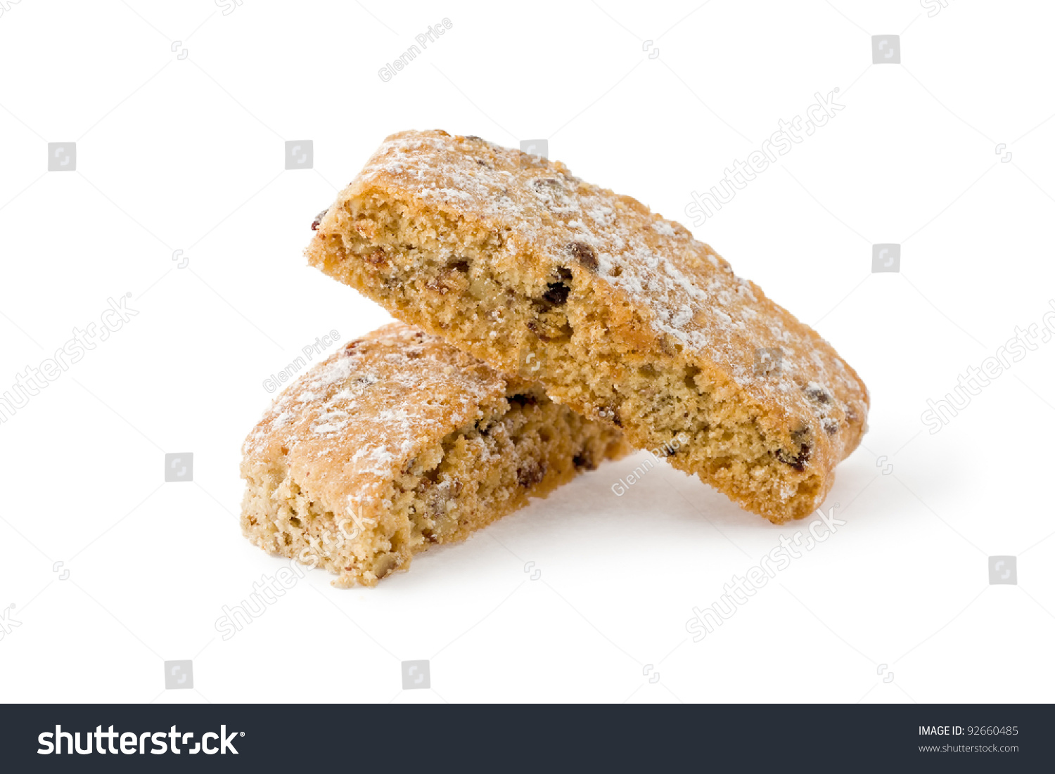 Two stacked pieces of jewish twice-baked almond cookies similar to biscotti against a white background. #92660485