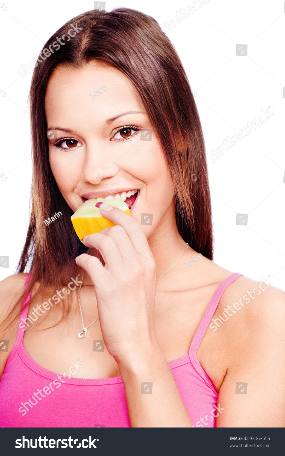 Young woman eating slice of yellow melon, isolated on white #93063559
