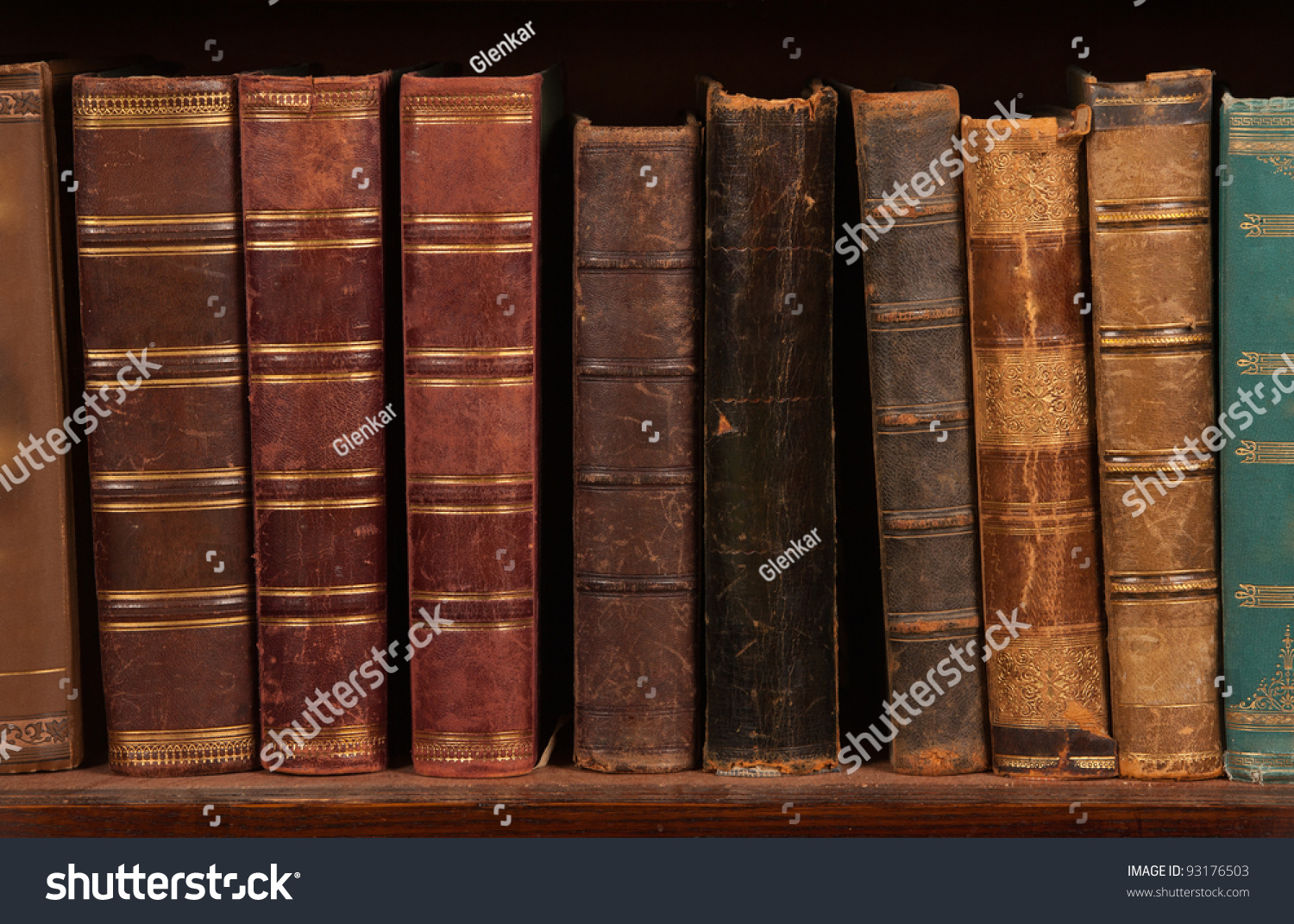 Antique books on bookshelf #93176503