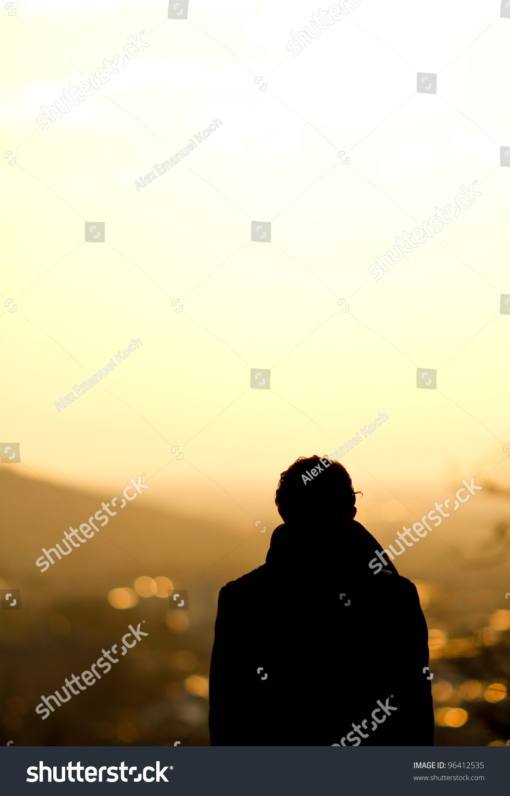 silhouette of man standing over freiburg in sunset #96412535