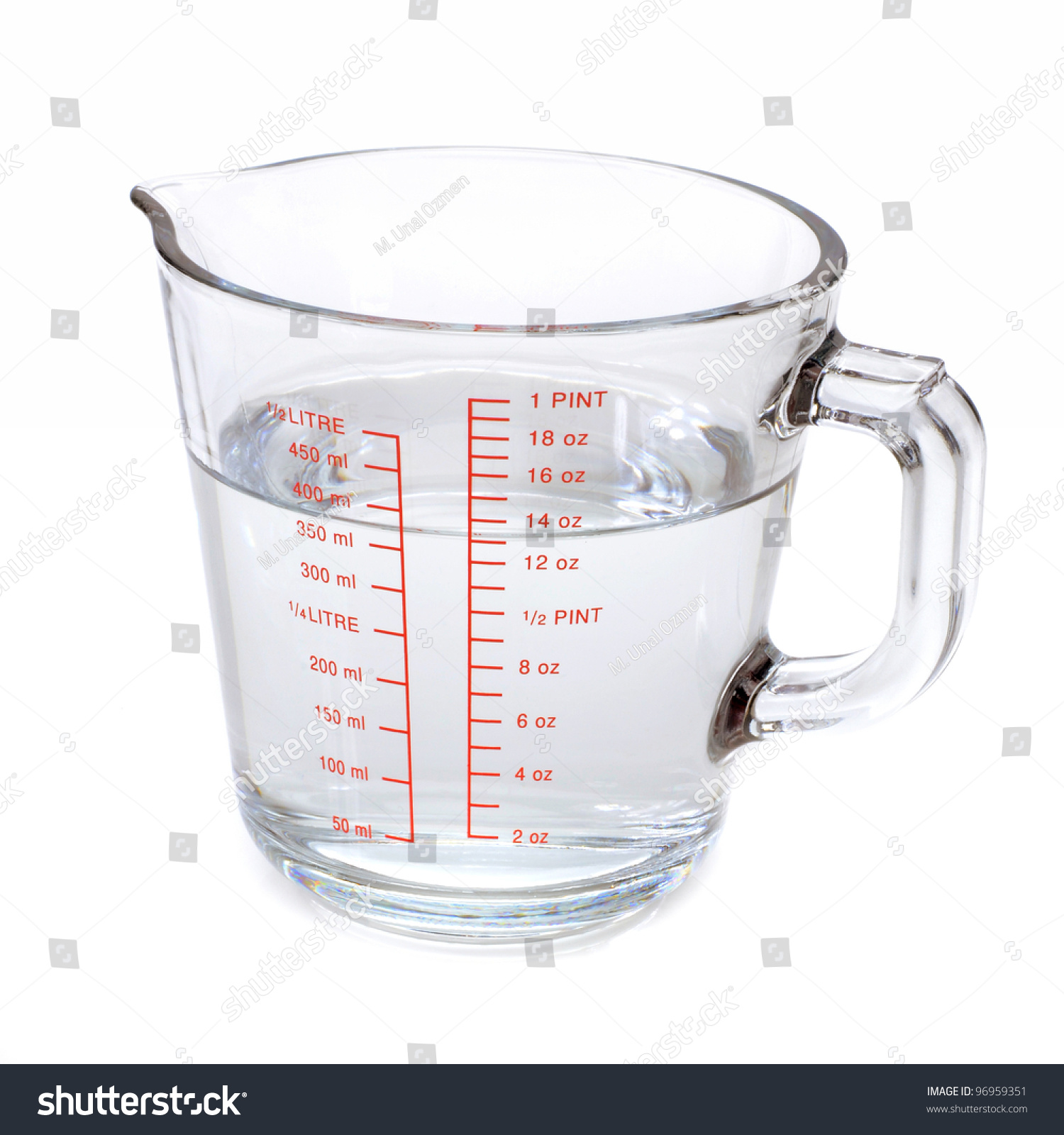 Water In Measuring Cup Isolated On White Royalty Free Stock Photo Avopix Com