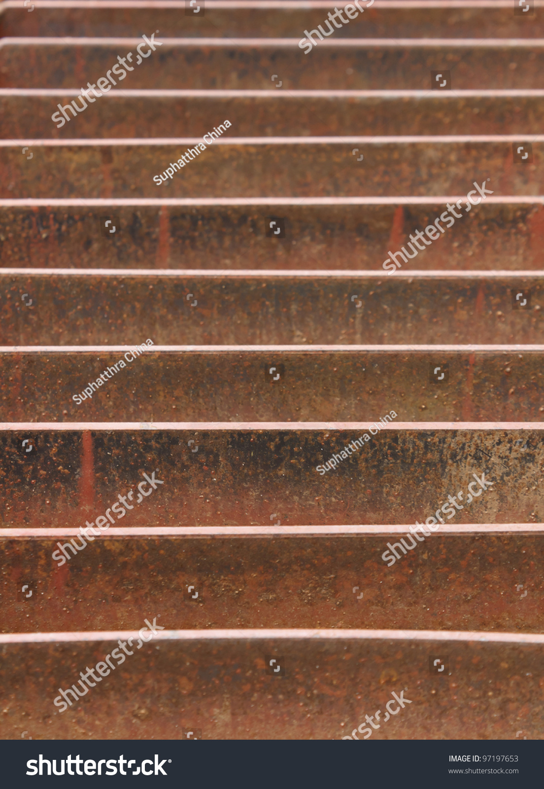 Abstract view of rusted metal storm drain on street #97197653