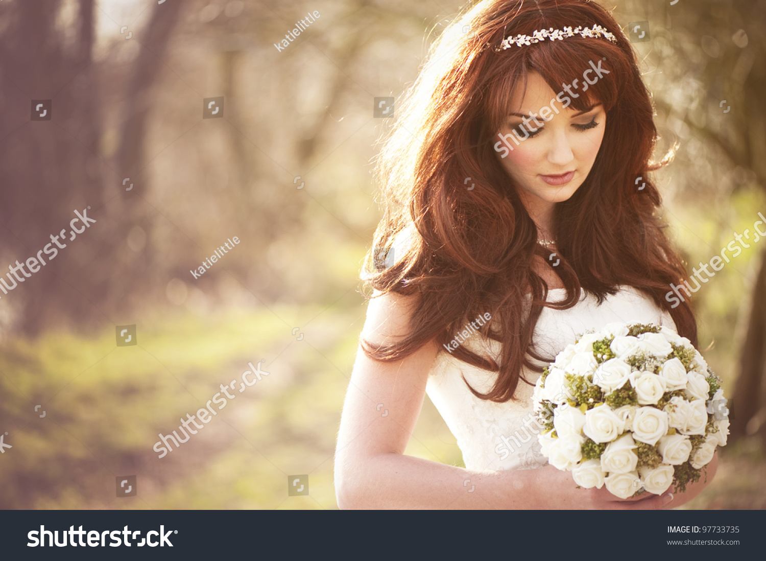 Beautiful bride outdoors in a forest. #97733735