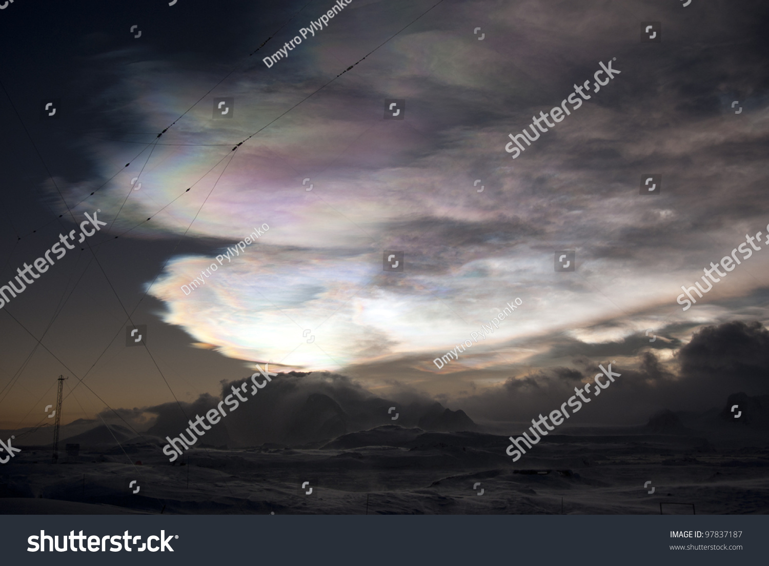Nacreous clouds over the mountains of the Antarctic Peninsula winter's night. #97837187