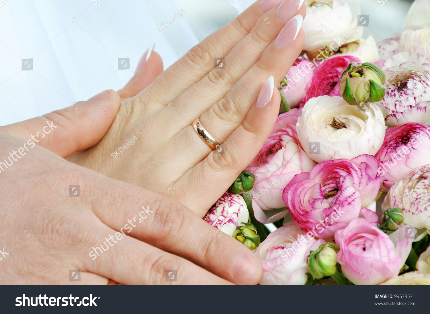 Hands and rings on wedding bouquet #99533531