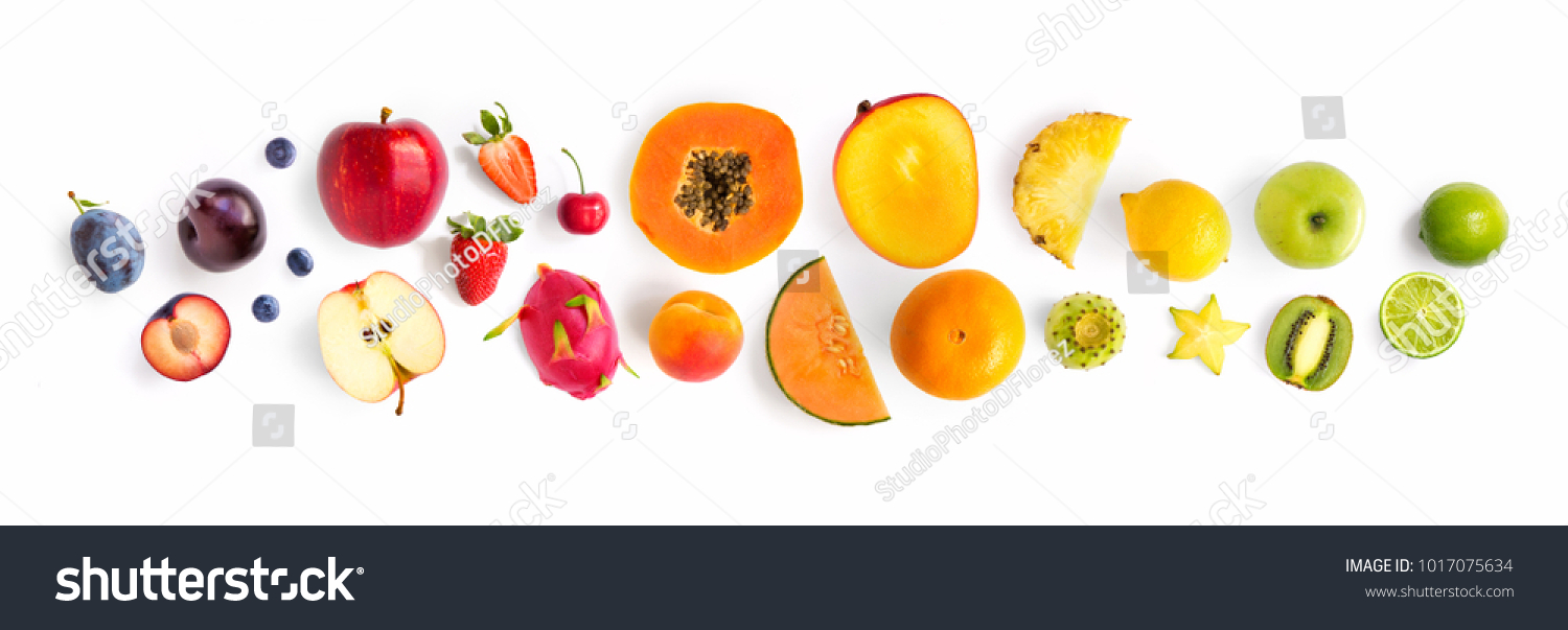 Creative layout made of fruits. Flat lay. Plum, apple, strawberry, blueberry, papaya, pineapple, lemon, orange, lime, kiwi, melon, apricot, pitaya, mango and carambola on the white background. #1017075634