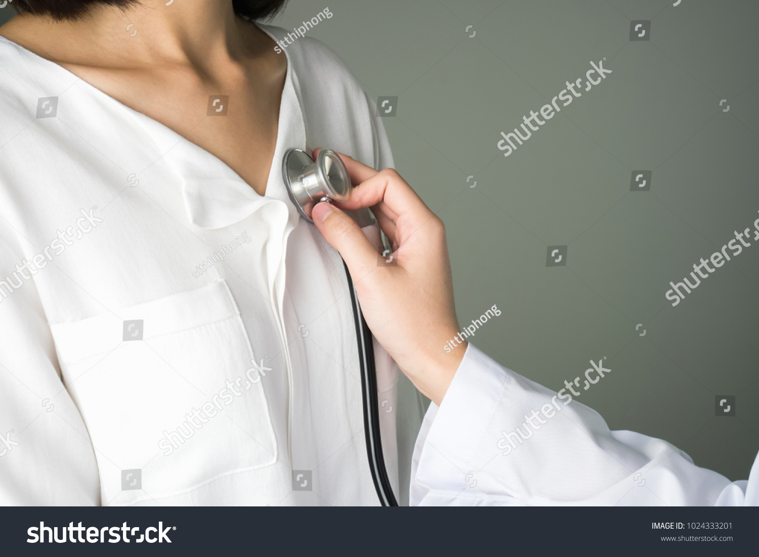 Doctor is using a stethoscope for patient examination. To hear the heart rate, For patients with heart disease. #1024333201