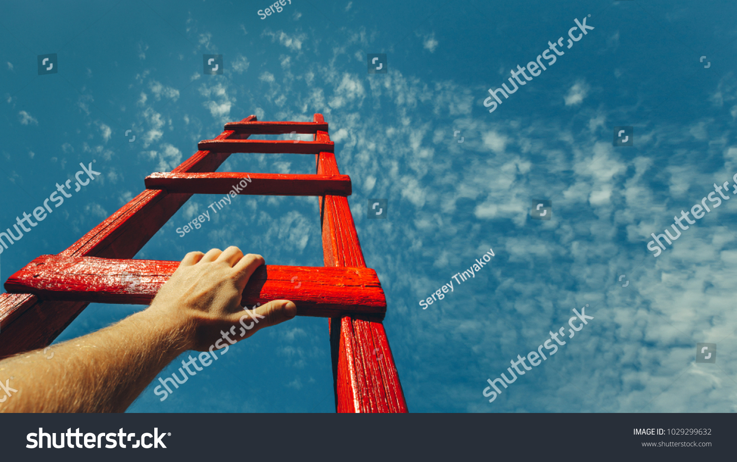 Development Attainment Motivation Career Growth Concept. Mans Hand Reaching For Red Ladder Leading To A Blue Sky #1029299632