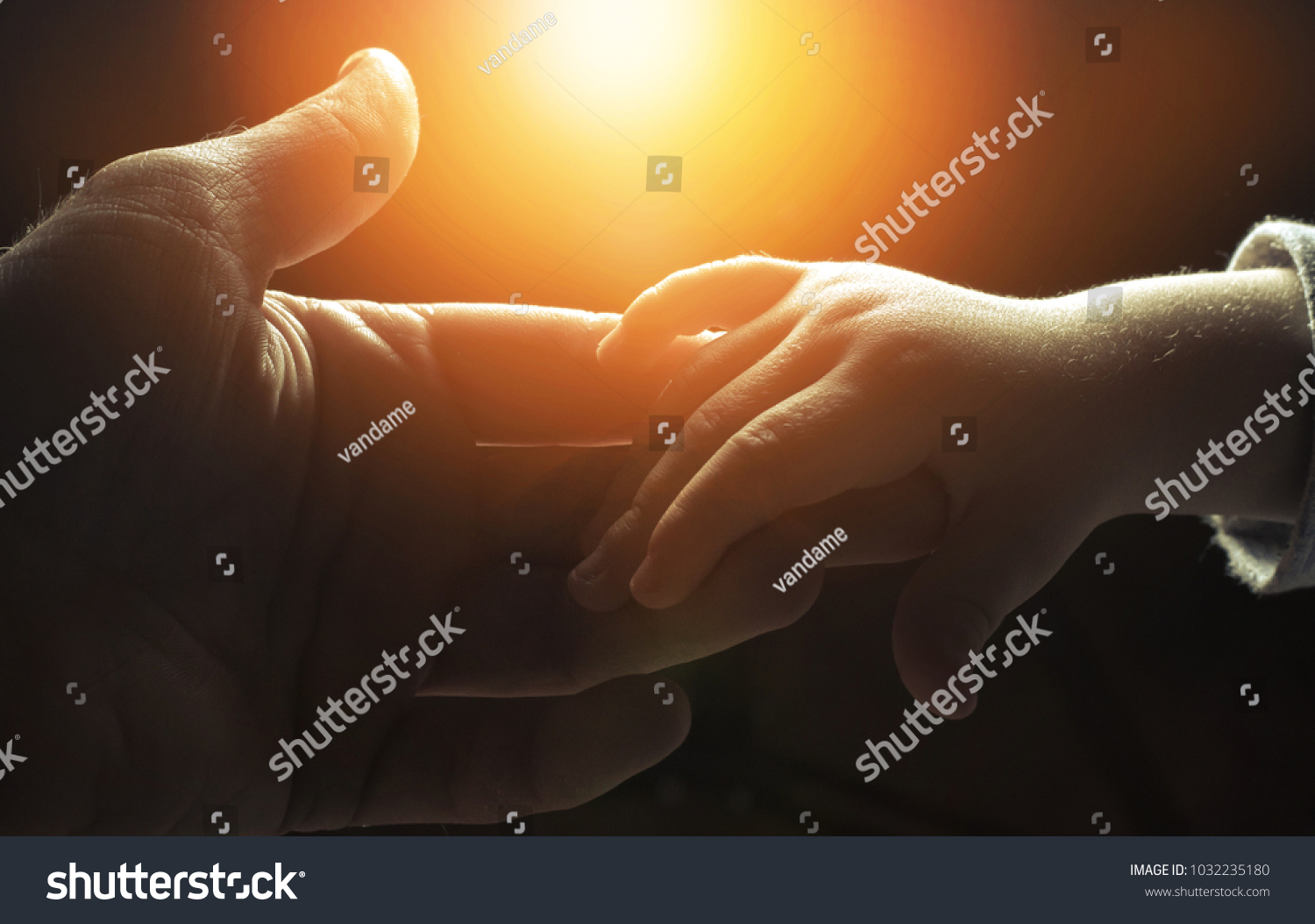 hand of man and child,God's help #1032235180