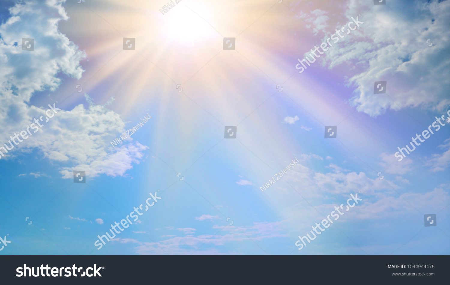 Miraculous Heavenly Light -  Blue sky, fluffy clouds and a beautiful warm orange yellow sun beaming down radiating depicting a holy entity 
 #1044944476