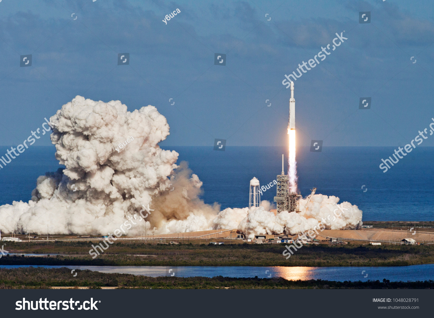 Rocket launch. Elements of this image furnished by NASA #1048028791