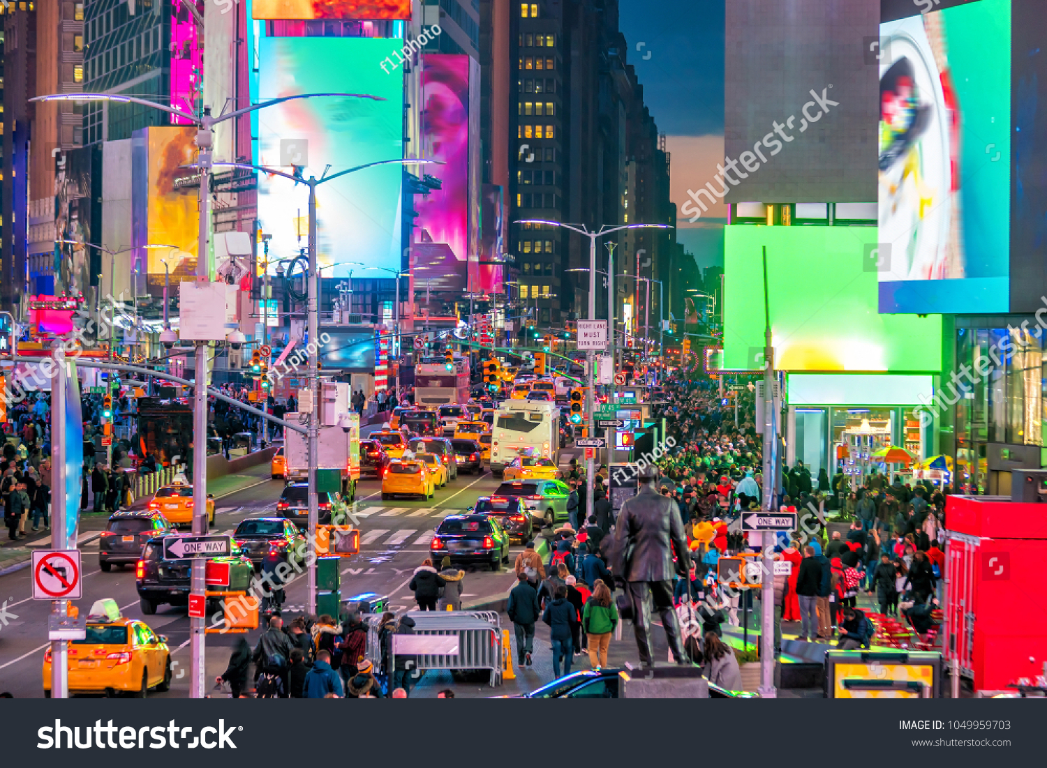 Times Square with neon art and commerce, an iconic street of Manhattan in New York City , United States  #1049959703