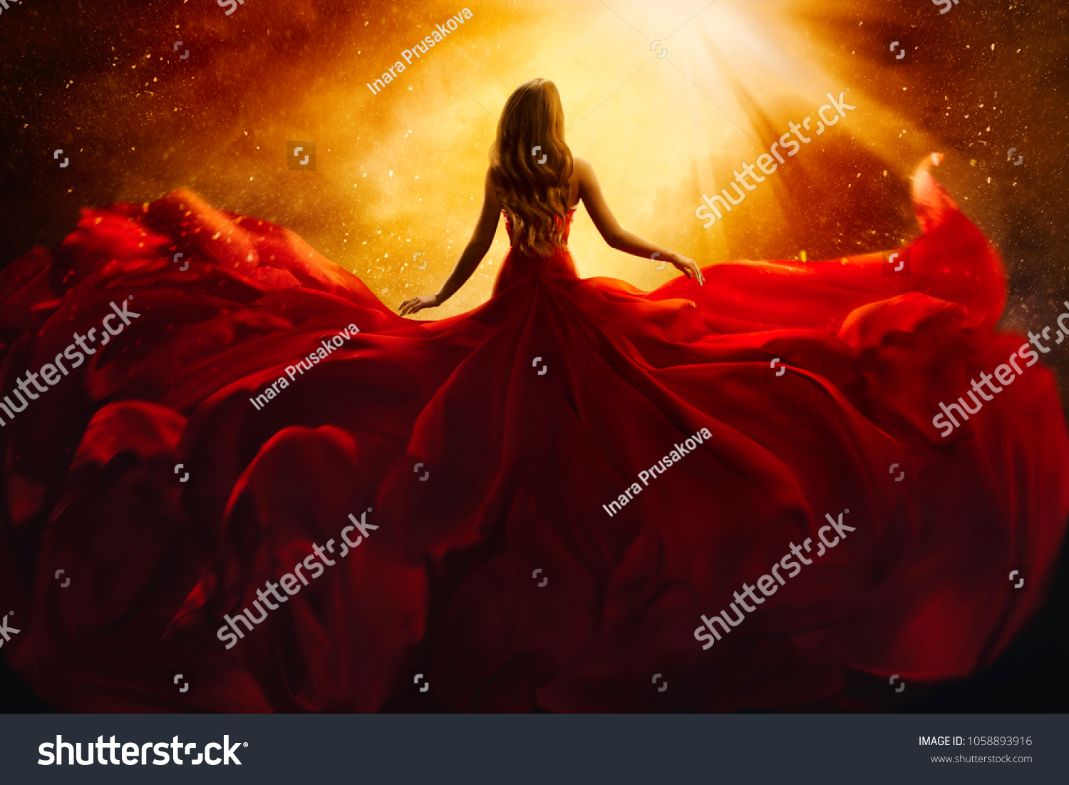 Fashion Model Back Side in Red Flying Dress, Woman Rear View, Gown Fabric Fly on Wind, Beautiful Girl Looking to Light #1058893916