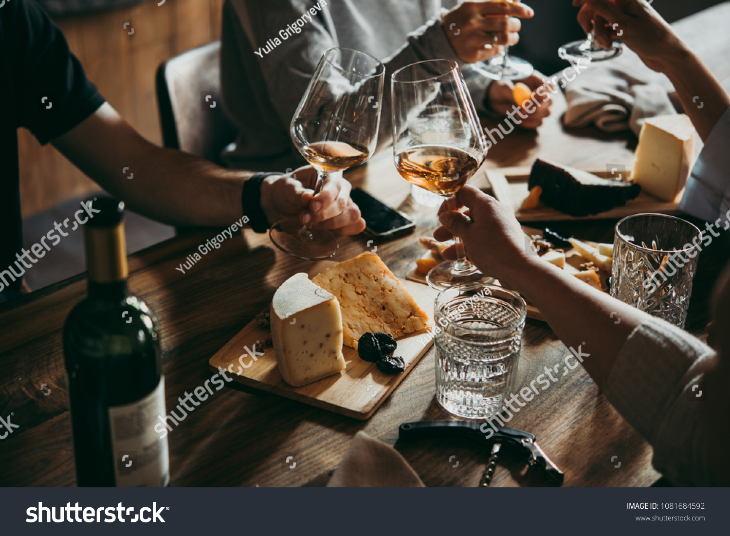 Wine and cheese served for a friendly party in a bar or a restaurant. #1081684592