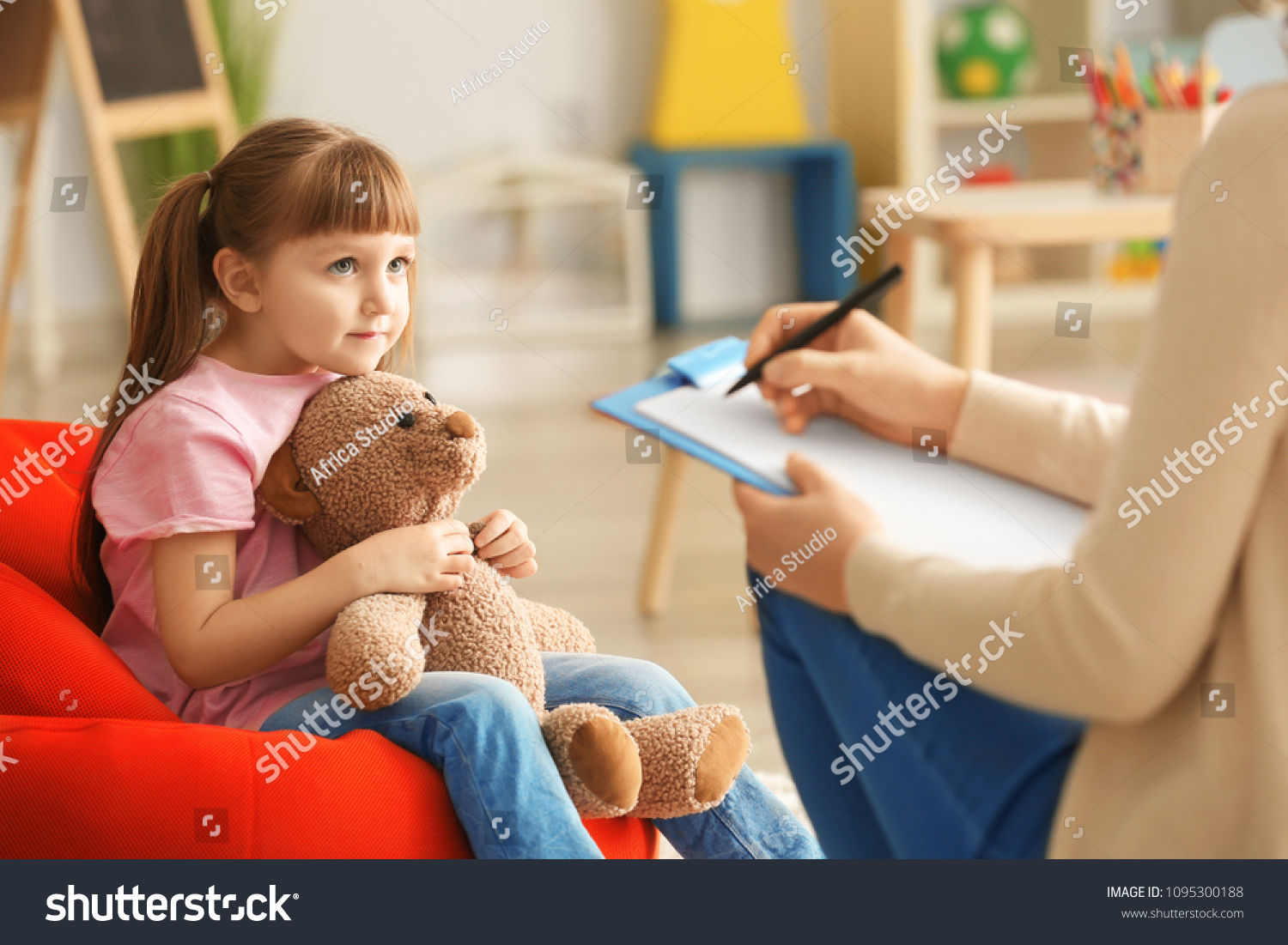 Cute little girl at child psychologist's office #1095300188