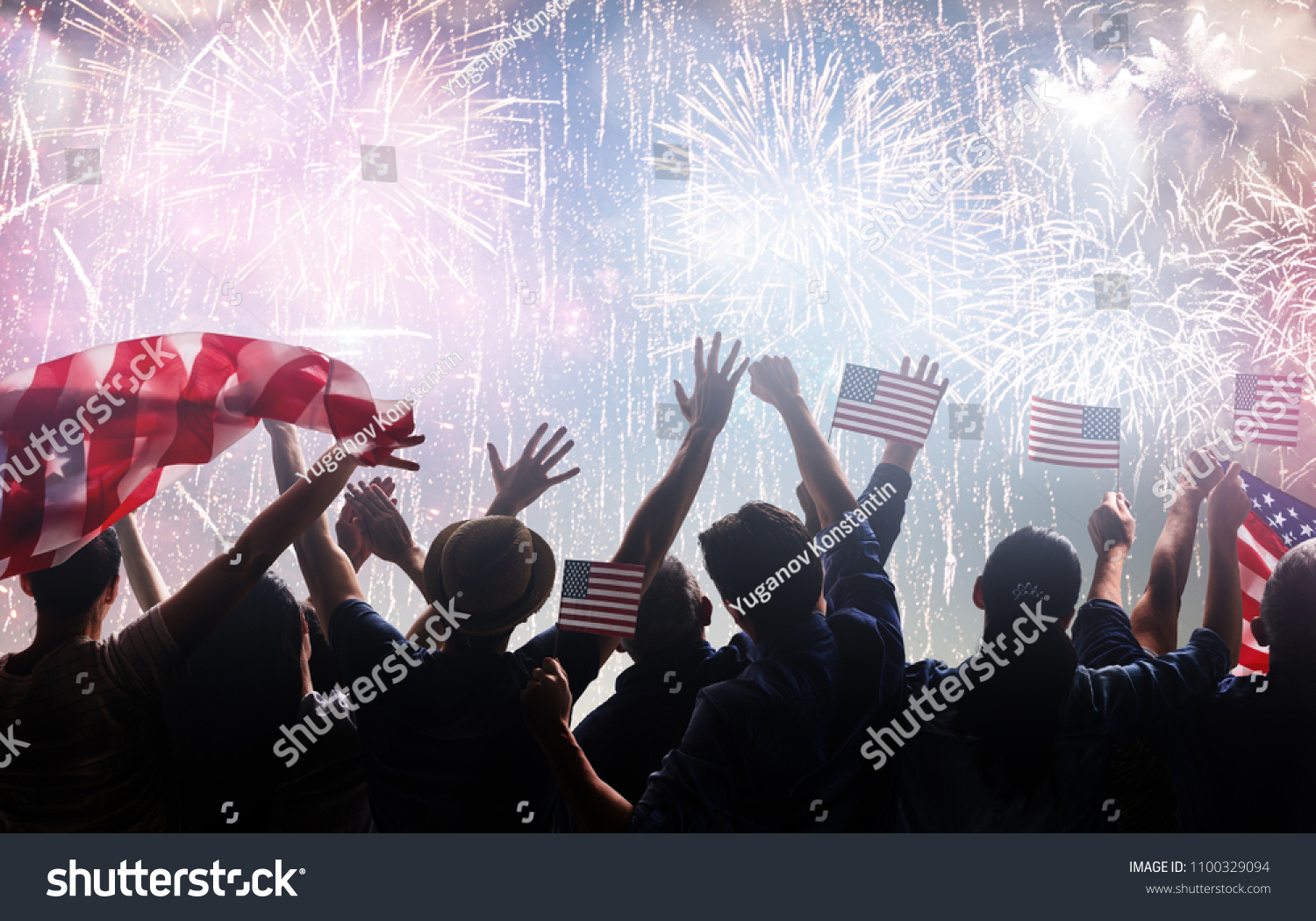 Patriotic holiday. Silhouettes of people holding the Flag of the USA. America celebrate 4th of July. #1100329094