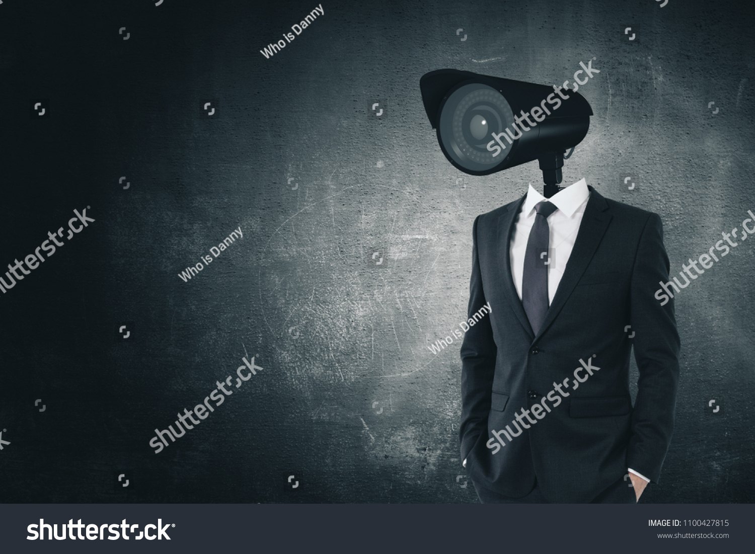 CCTV camera headed businessman standing on dark concrete background with copy space. Supervision and spy concept #1100427815