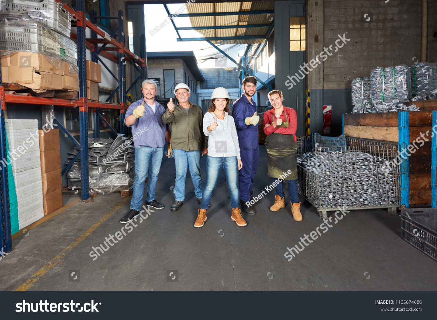 Group of workers in metallurgy factory as a successful team #1105674686