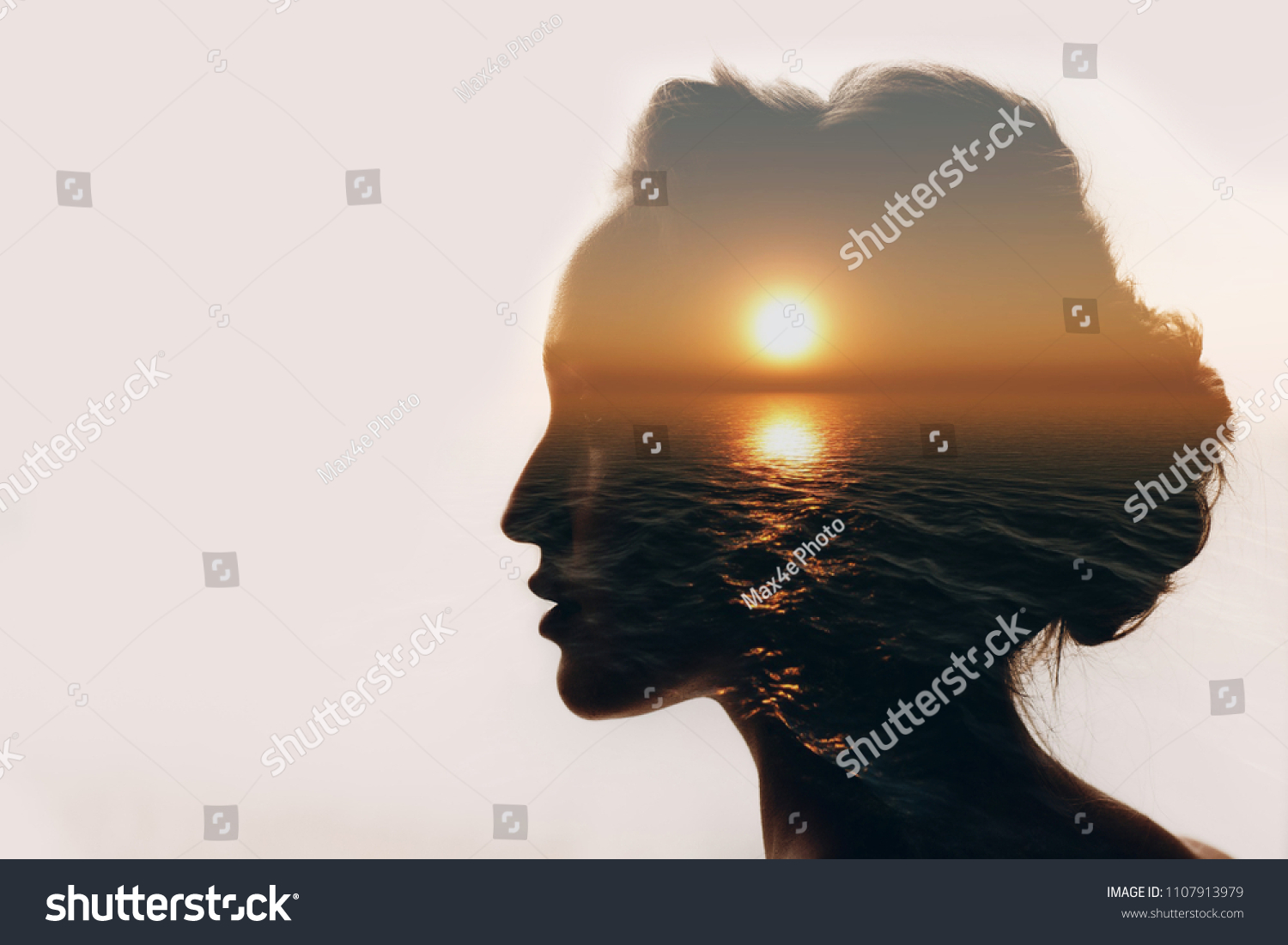 Psychology concept. Sunrise and dreamer woman silhouette. #1107913979
