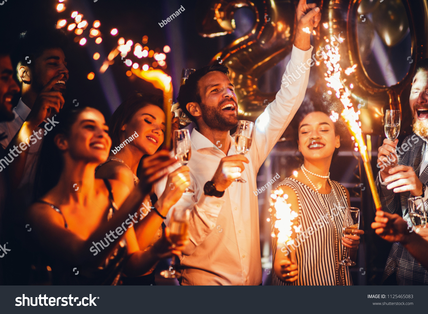 Group of friends celebrating with champagne #1125465083
