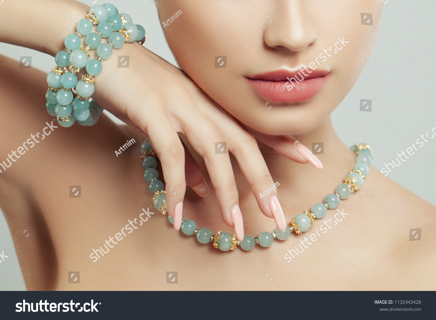 Perfect jewelry on female body, closeup portrait. Bracelet, necklace and manicure #1132443428