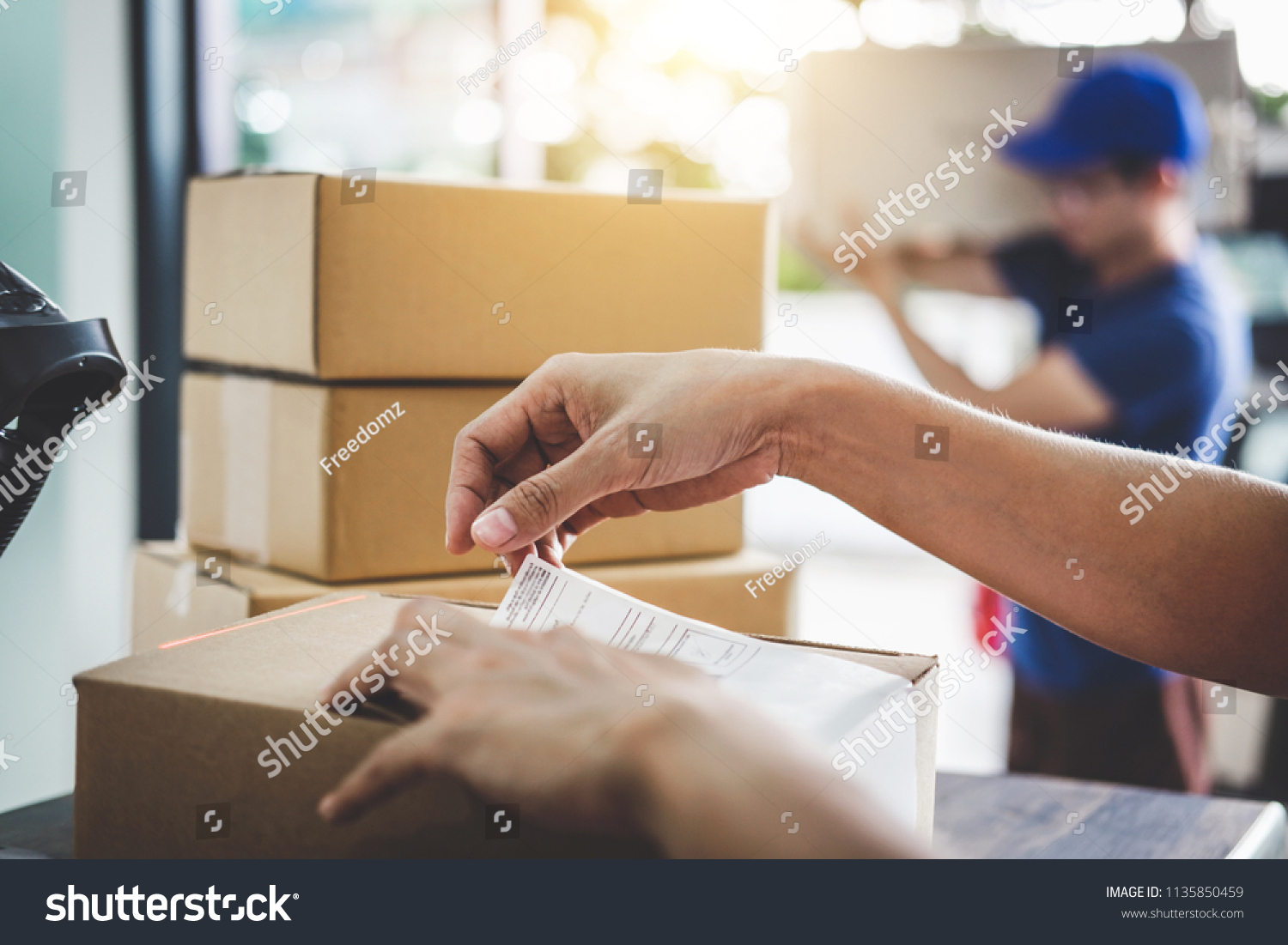 Home delivery service and working service mind, Woman working barcode scan to confirm sending customer in post office. #1135850459