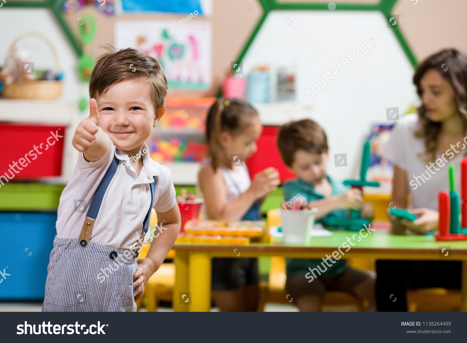 Preschool Children and Teacher in Classroom #1138264499