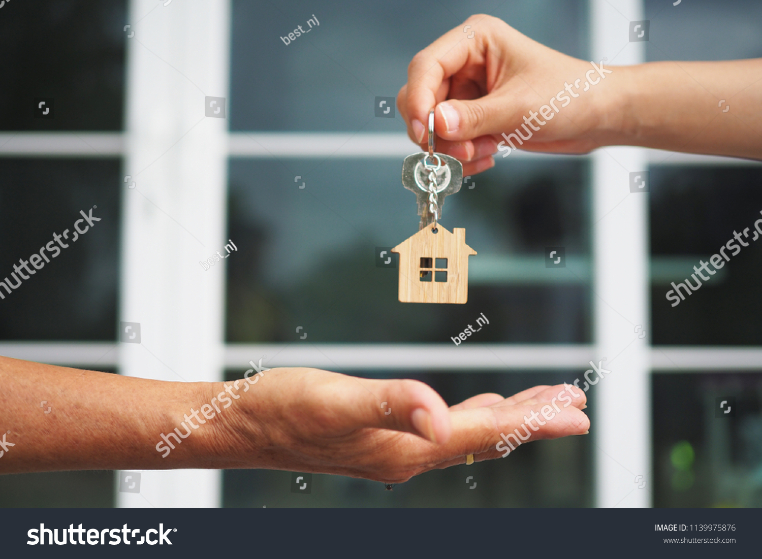 Home buyers are taking home keys from sellers. Sell your house, rent house and buy ideas.        #1139975876