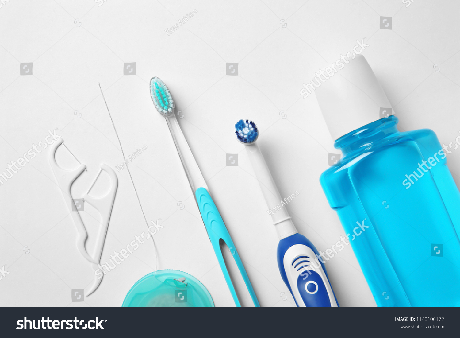 Flat lay composition with toothbrushes and oral hygiene products on white background #1140106172